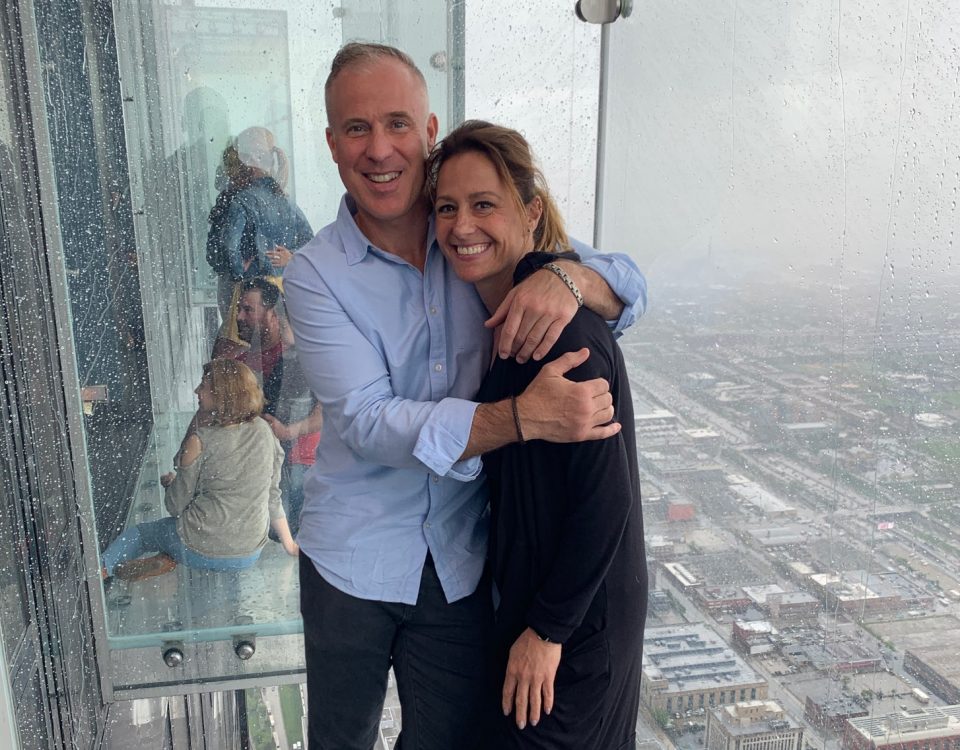 Dave and Debbie on the sky deck overlooking the cityscape