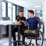 a man in a wheelchair with robotic prosthetic arms - Do not let anything stand in your way