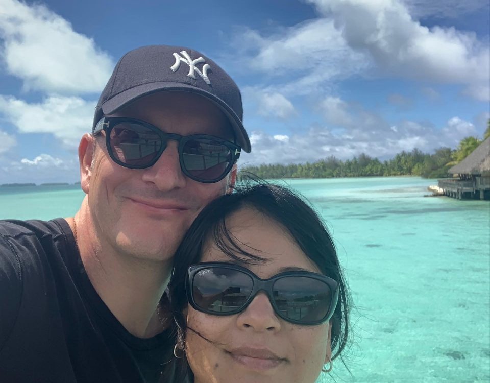 Sylvia Kumi Christopolous with her husband along the Middle American ocean