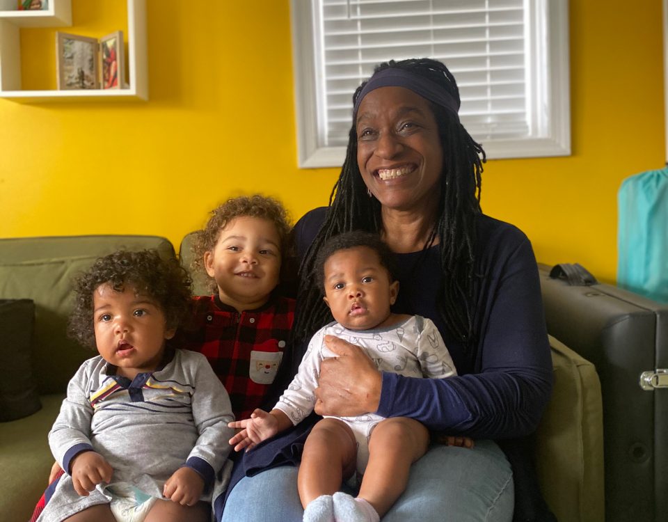 Carole Campbell with the three kids on the couch