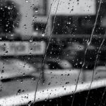 raining on the window black and white