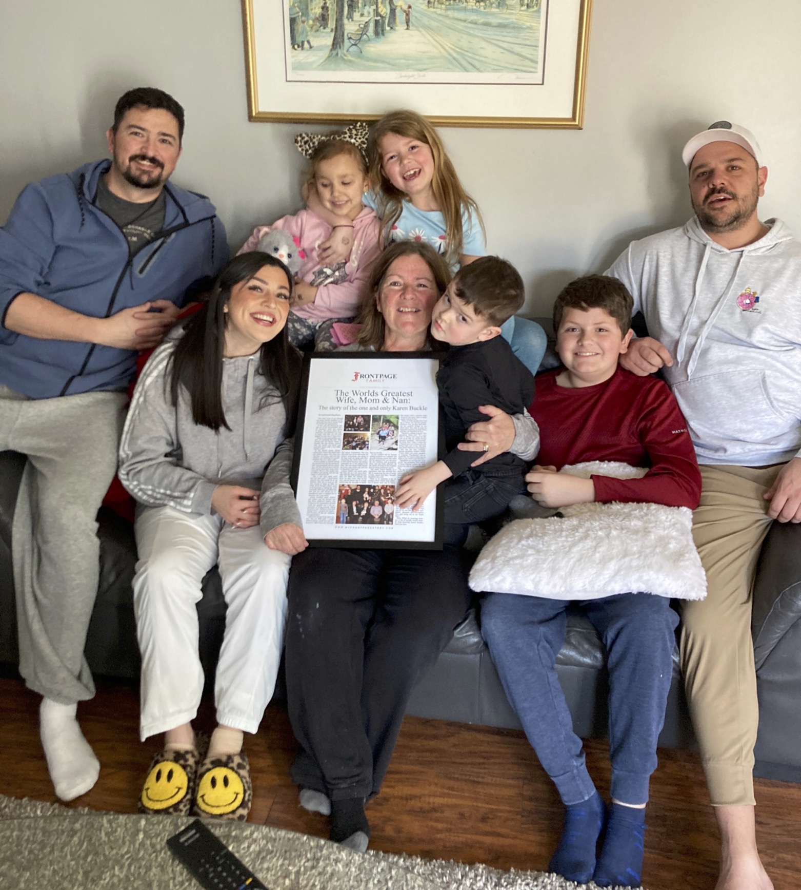 Mom smiling with personalized newspaper story and family (deluxe)
