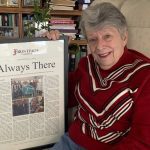 Mom smiling with personalized newspaper story (basic)