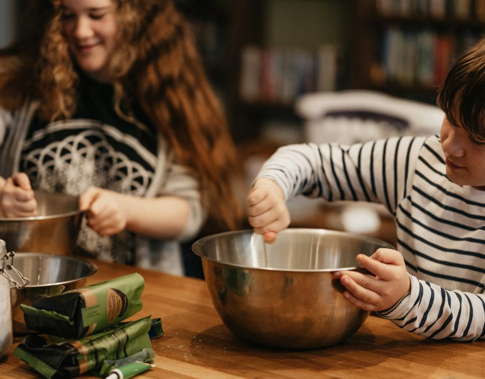 son cooking with Mom in the kitchen - a unique Mother's Day gift