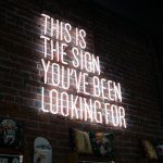 Neon sign that says This is the sign you've been looking for - blog topics that rank well blog post