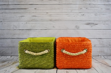 two baskets for storage - one green, one orange