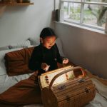 a girl opening a basket showing the power of an imaginative mind