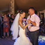 Ukraine, Odessa 07.09.2013. Beautiful bride daughter is dancing with her father in the circle of guests at her wedding